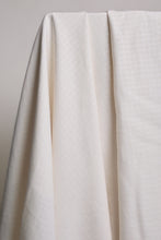 Load image into Gallery viewer, Close-up of white fabric draped over a surface with a neutral background