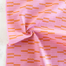 Load image into Gallery viewer, Pink fabric with orange pattern and 'Fableism' branding on a light background