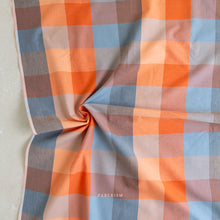 Load image into Gallery viewer, Checkered fabric with orange, blue, and brown pattern on a beige background