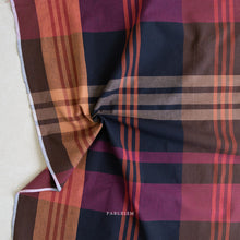 Load image into Gallery viewer, Plaid fabric with a mix of red, brown, and purple colors on a neutral background.