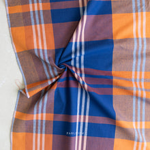 Load image into Gallery viewer, Plaid fabric with orange, blue, and brown colors on a white background