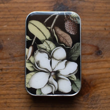 Load image into Gallery viewer, Small rectangular tin with floral design on a wooden surface