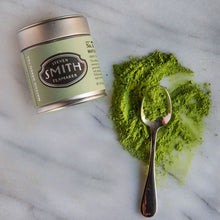 Load image into Gallery viewer, Steven Smith matcha green tea canister with spoonful of green powder on marble surface