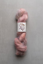 Load image into Gallery viewer, Ball of pink yarn with a label on a gray background