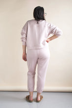 Load image into Gallery viewer, Person wearing a light pink outfit standing against a plain background