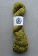 Load image into Gallery viewer, Green skein of yarn with a label on a gray background