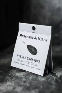 Merchant & Mills needle threader packaging on a dark background