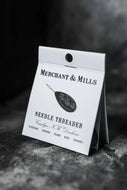 Merchant & Mills needle threader packaging on a dark background
