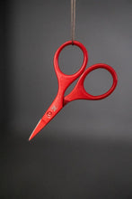 Load image into Gallery viewer, Red scissors hanging from a string against a gray background