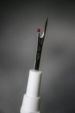 Load image into Gallery viewer, Sewing needle with white handle and red bead on a gray background