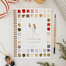 Load image into Gallery viewer, Watercolor workbook titled 'Nutcracker' with color swatches on a white surface.