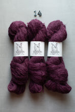 Load image into Gallery viewer, Three skeins of deep plum purple yarn with white paper bands showing the 'Barnyard' brand logo, arranged side-by-side on a light gray textured background with the number '14' printed above them.