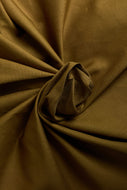 Close-up of brown fabric with folds