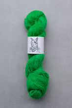 Load image into Gallery viewer, Green skein of yarn with a label on a gray background