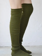 Load image into Gallery viewer, Green ribbed knee-high socks worn by a person on a white background