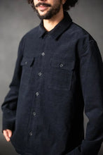 Load image into Gallery viewer, Man wearing a dark blue button-up shirt against a gray background