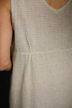 Load image into Gallery viewer, Close-up of a sleeveless checkered dress with a neutral background