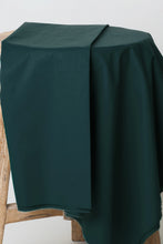 Load image into Gallery viewer, Dark green tablecloth draped over a wooden chair against a white background