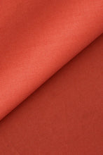 Load image into Gallery viewer, Close-up of terracotta-colored fabric with a slight texture.