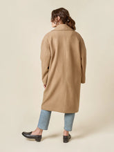 Load image into Gallery viewer, Person wearing a beige coat on a plain background
