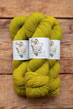 Load image into Gallery viewer, Three skeins of green yarn with 'Pashmin' labels on a wooden background