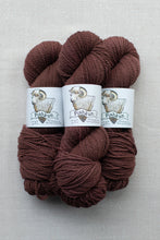Load image into Gallery viewer, Three skeins of Pishkun brand yarn in a rich dark brown color, arranged vertically on a light gray textured background.
