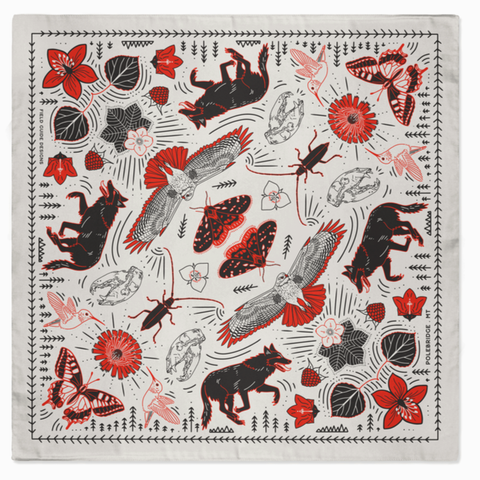 Decorative square blanket with nature-themed pattern on a white background