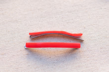Load image into Gallery viewer, Red pliers on a textured beige surface