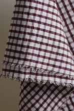 Load image into Gallery viewer, Close-up of a checkered fabric with frayed edges on a plain background