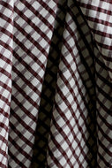 Close-up of checkered fabric with brown and white pattern