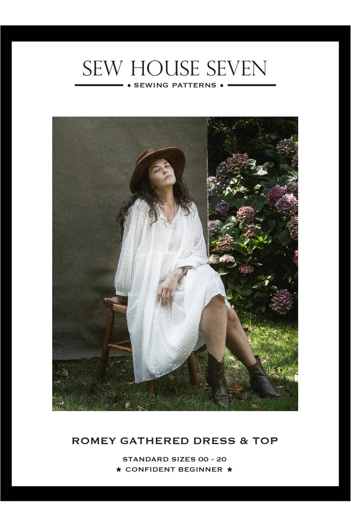 Sew House Seven sewing pattern cover with a woman in a white dress sitting outdoors.