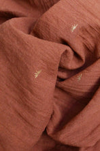 Load image into Gallery viewer, Close-up of textured brown fabric with small gold embellishments