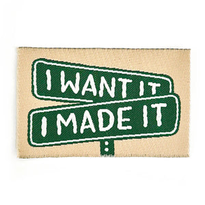 Patch with 'I WANT IT' and 'I MADE IT' text on a beige background
