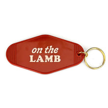 Load image into Gallery viewer, Red keychain with &#39;on the LAMB&#39; text on a white background