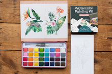 Load image into Gallery viewer, Watercolor painting kit with color swatches, a painting, and packaging on a wooden surface.