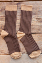 Load image into Gallery viewer, Pair of brown socks with beige accents on a wooden surface
