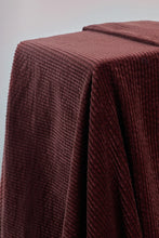 Load image into Gallery viewer, Brown textured fabric draped over a surface with a plain background