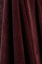 Load image into Gallery viewer, Close-up of dark red fabric with a textured pattern