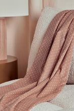 Load image into Gallery viewer, Brown polka dot blanket draped over a chair with a blurred background