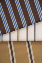 Load image into Gallery viewer, Striped fabric with brown, blue, white, and beige colors on a brown background.