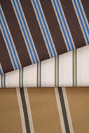 Striped fabric with brown, blue, white, and beige colors on a brown background.