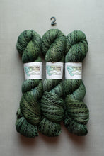 Load image into Gallery viewer, Three skeins of variegated green and blue yarn with white paper labels reading Great Falls Mountain, arranged vertically on a light gray textured background with a small black number 2 above them.