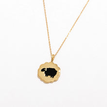 Load image into Gallery viewer, Gold necklace with a black silhouette pendant on a white background