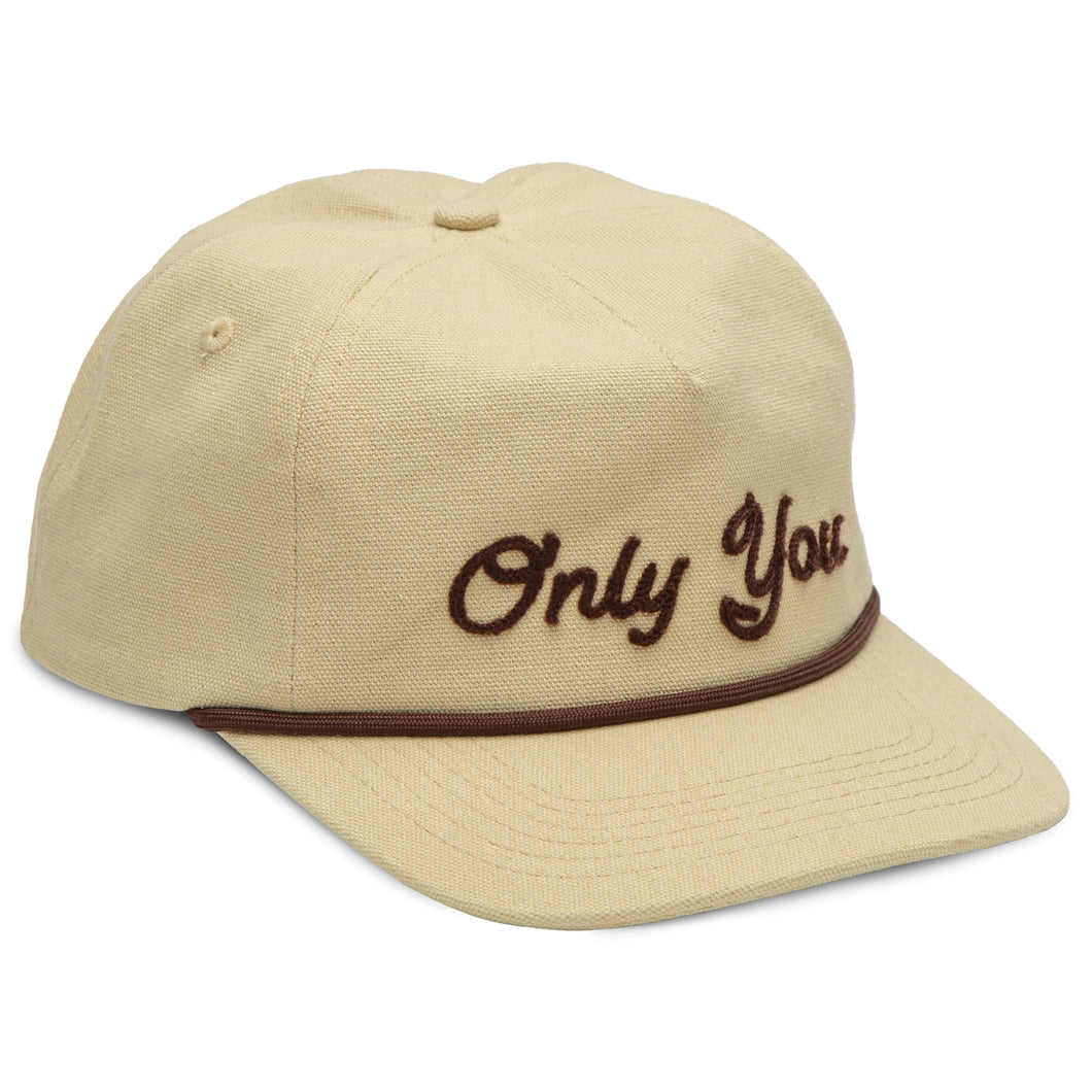 Beige cap with 'Only You' embroidery on a white background