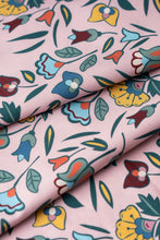 Load image into Gallery viewer, Floral patterned fabric with colorful flowers on a pink background