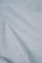 Load image into Gallery viewer, Close-up of textured light blue fabric with folds