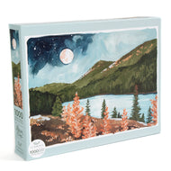 Jigsaw puzzle box with a mountain and lake scene design