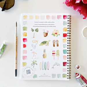 Art book titled 'Learn to Paint with Watercolor' on a table with art supplies.