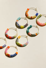 Load image into Gallery viewer, Colorful beaded hoop earrings on a light background