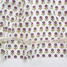 Load image into Gallery viewer, Floral patterned fabric with 'Fableism' branding on a white background